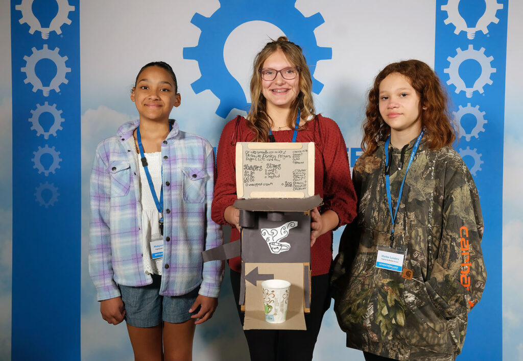 2023 Regional Inventionland®Contest. Photo of the students and their invention