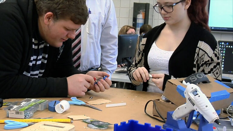 students collaborate on an assignment